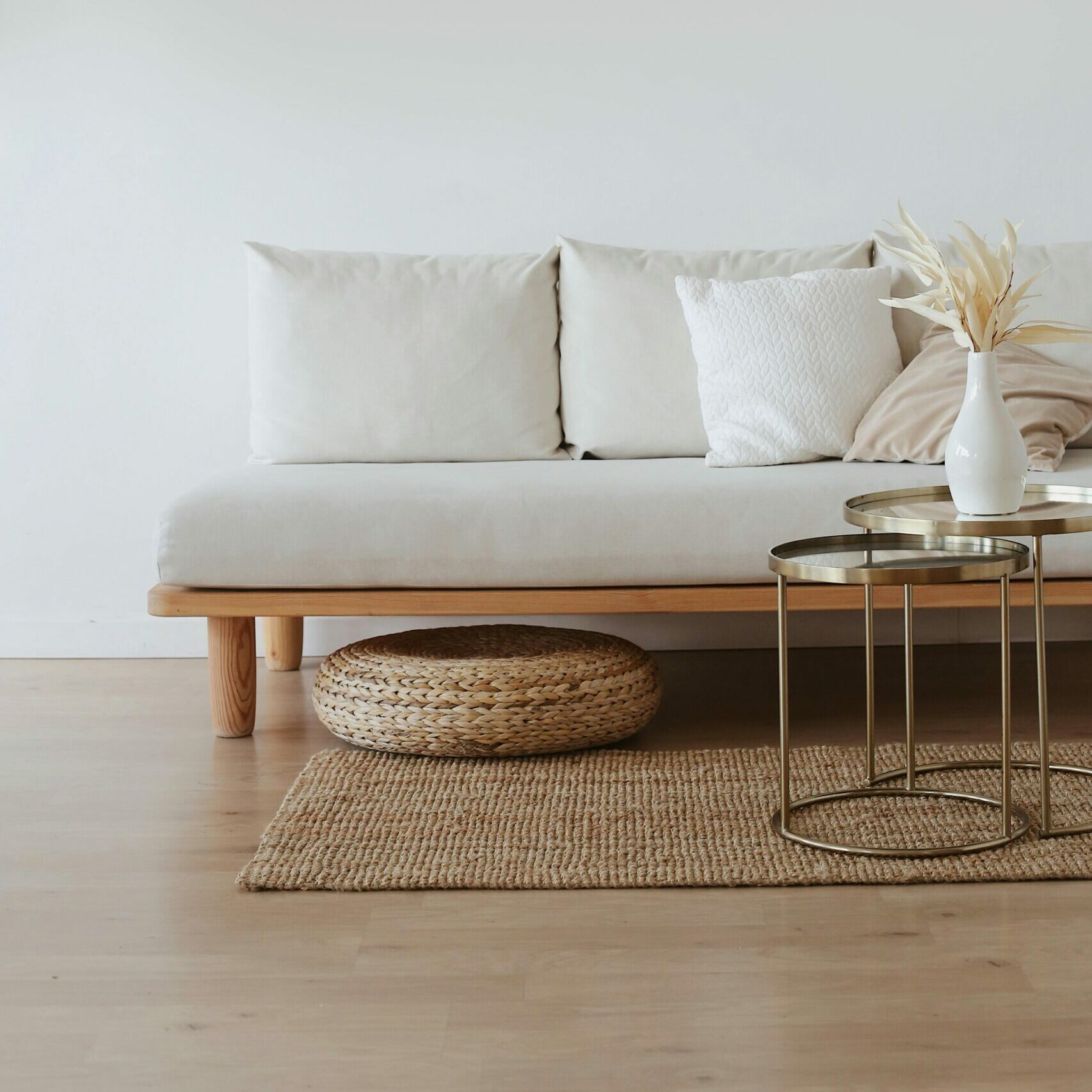 White Couch on Wooden Floor